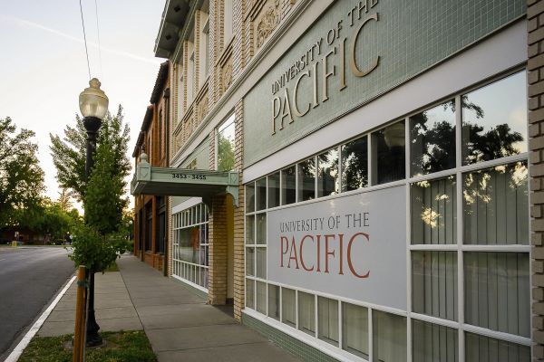 the front of a building with the university of the pacific logo