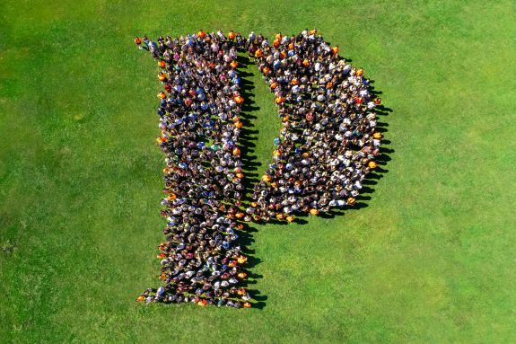 Students form the Pacific "P" shape.