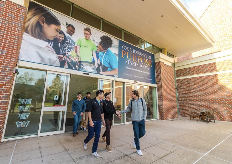 students walk outside the DUC