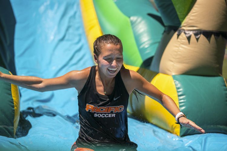 student on water slide