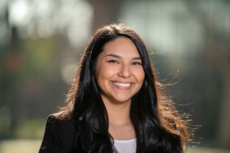 A close up portrait of a woman in a suit