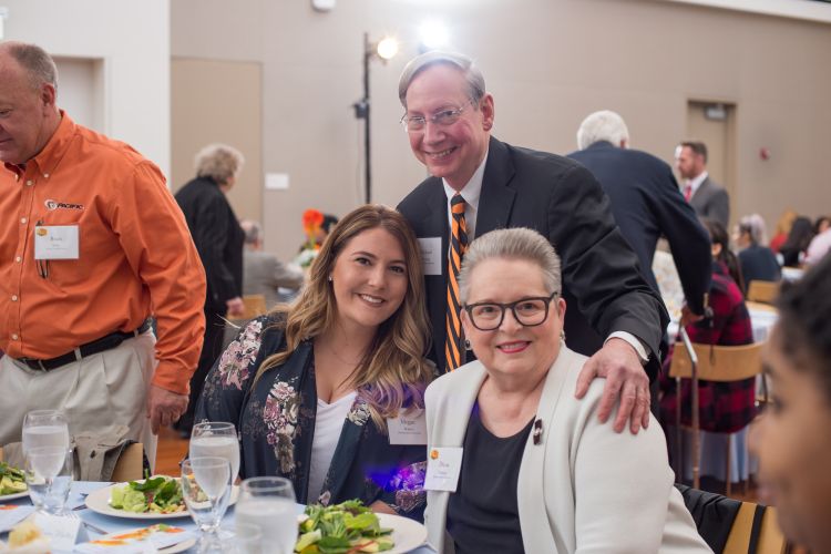 Photo of Pacific scholarship recipient with Rick and Diana Fleming