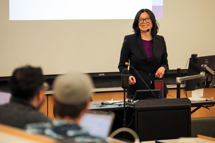 A female professor teaches a class