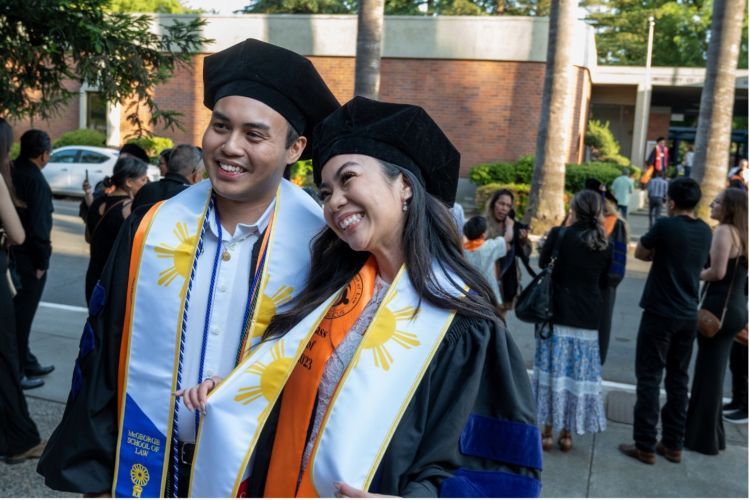 Darrin Baluyot ’23 and Janize Sarmiento ’23 celebrate their graduation at McGeorge School of Law’s Annual Unity Graduation in 2023.