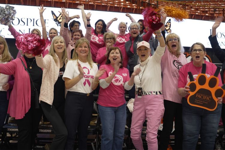 First Lady Jean Callahan with other women leaders at a women's basketball game. 