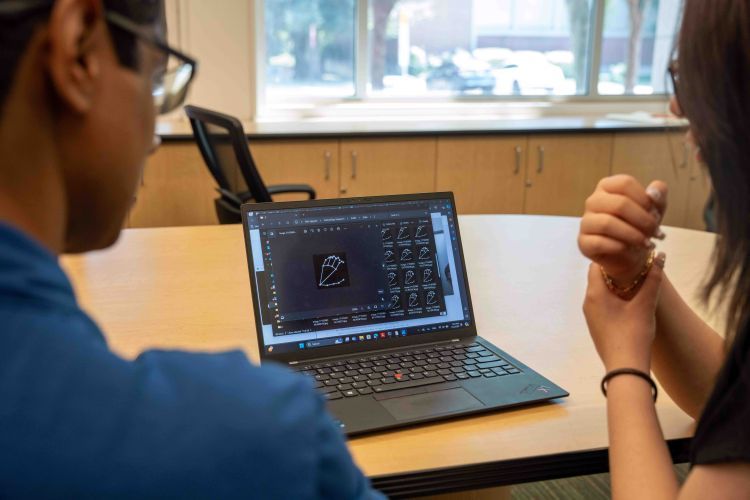 Associate Professor Vivek Pallipuram and Khanh Linh Nguyen ’25 collaborating on their research.