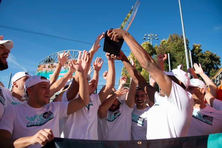 The water polo team celebrates their win after the game.