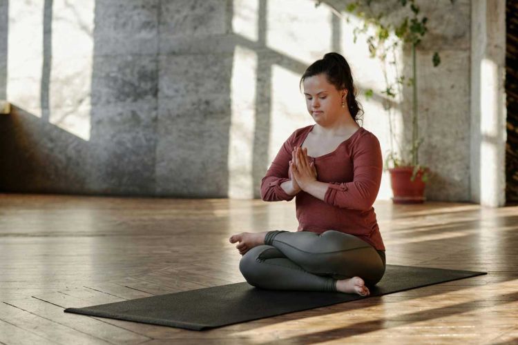 Photo by Cliff Booth: https://www.pexels.com/photo/photo-of-woman-meditating-alone-4056968/