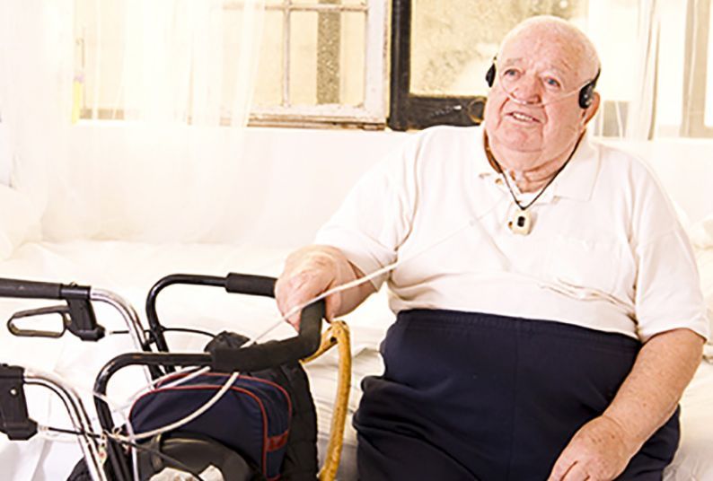 older man with assistive equipment