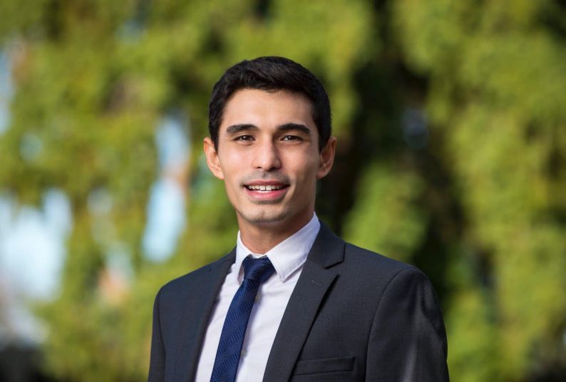 A portrait of a man wearing a suit