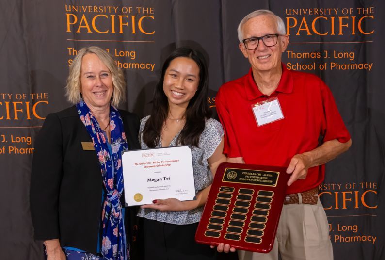 Left to right: Dean Berit Gunderson, Megan Tri and Ed Larimer.