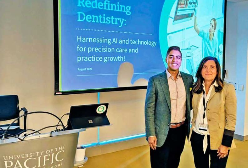 man and woman standing side by side in front of a projection screen in a classroom