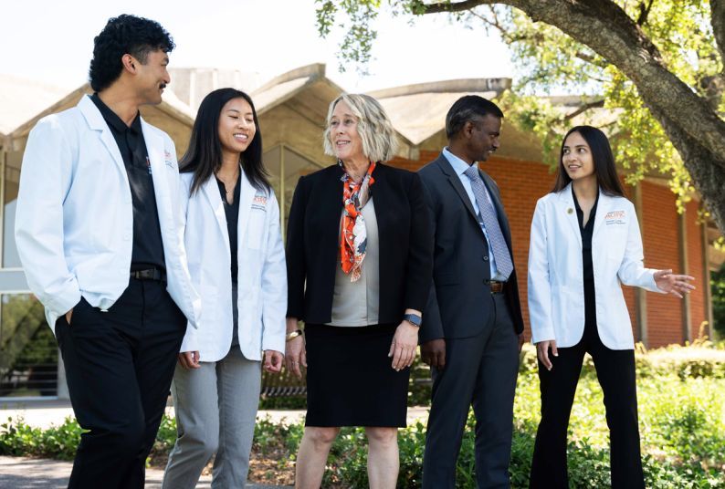 Dean Berit Gundersen and Dr. Srikanth Kolluru with students