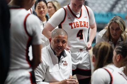 Bradley Davis surrounded by his team