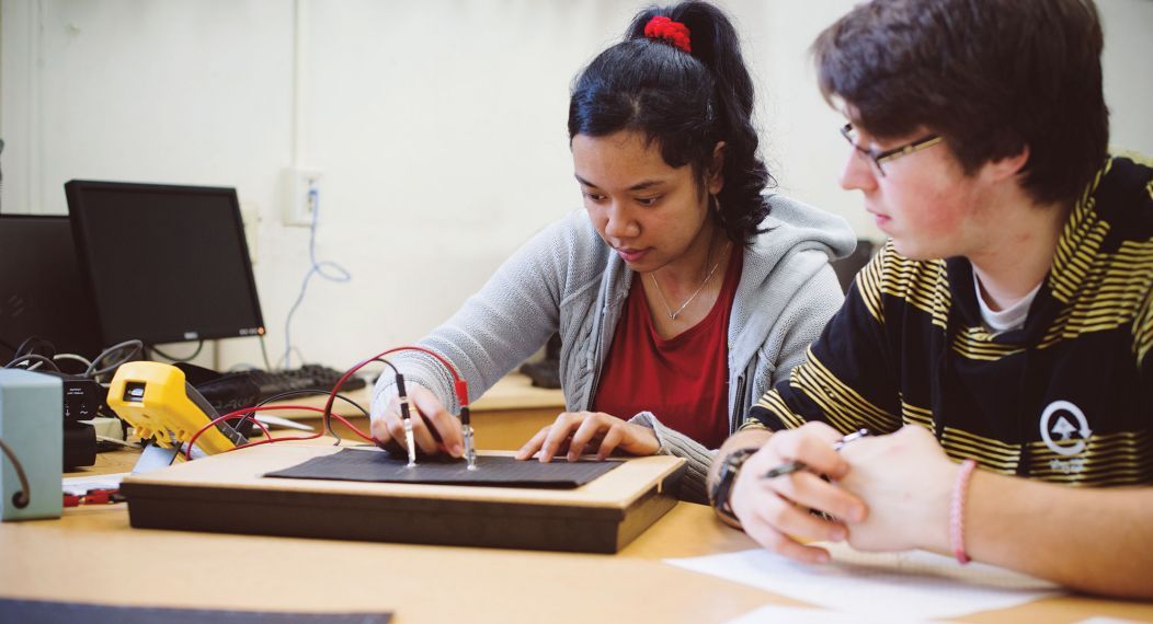 physics students studying in laboratory