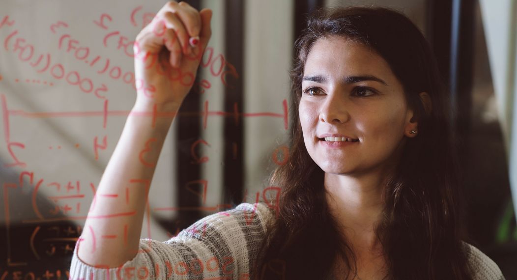 math student writing on glass