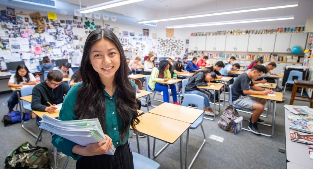 Teaching student in a high school classroom