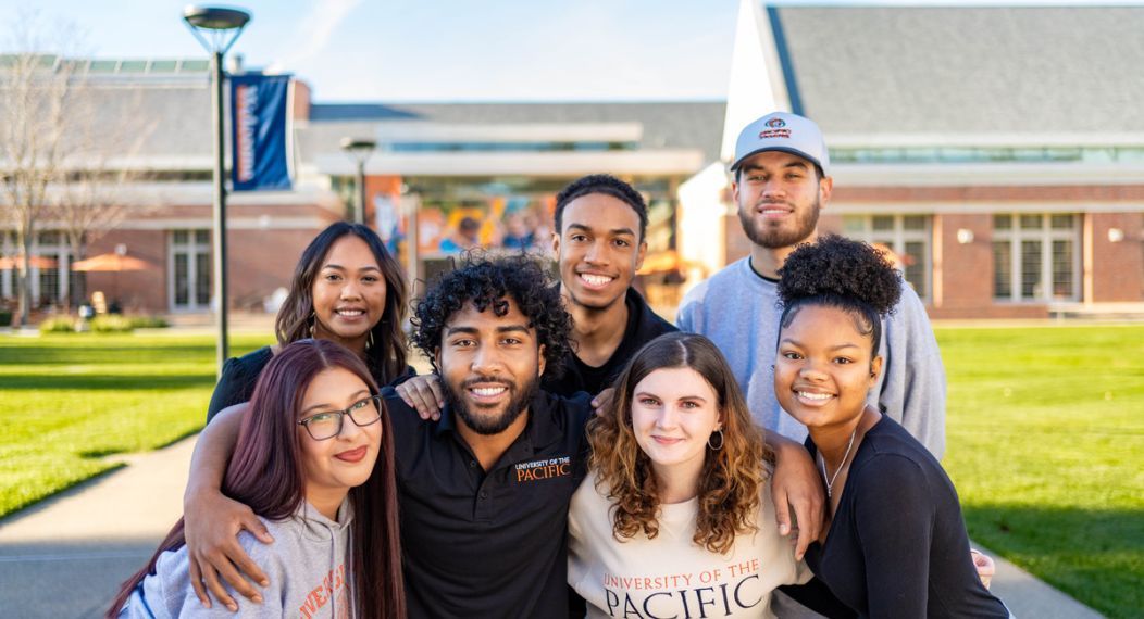 A group of students wearing Pacific gear outside the DUC