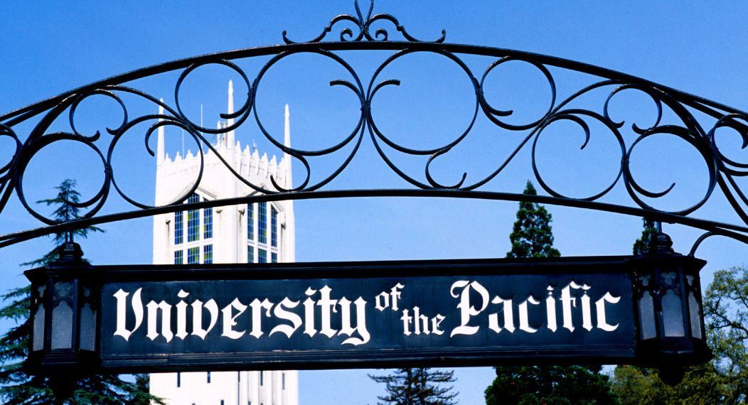 university gate with tower in the background