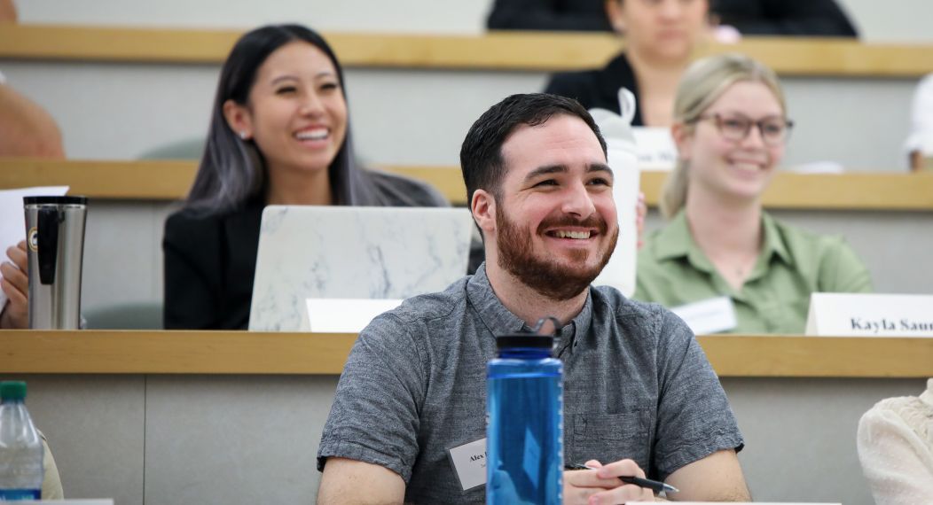 students in classroom smiling