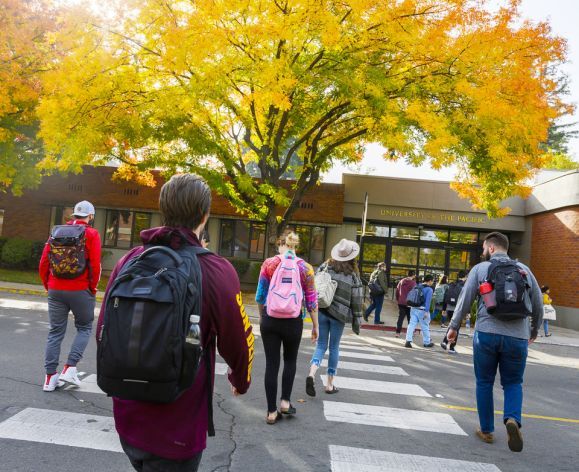 students walk to class on the Sacramento campus