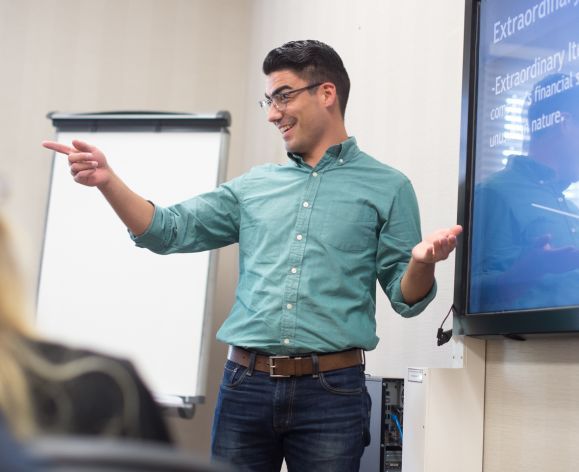 Man presenting to a business class